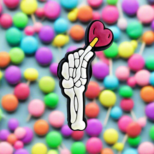 Skelly Holding Lollipop Croc Charm